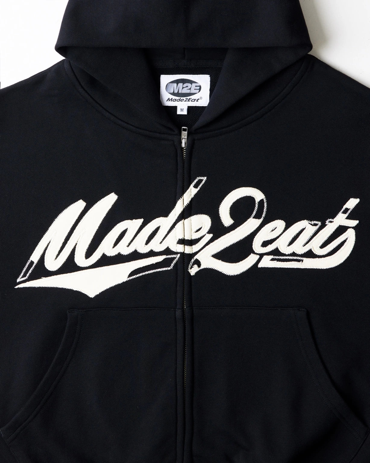 Black rope stitched hoodie with made2eat stitched across the chest. Made from 420 GSM French terry