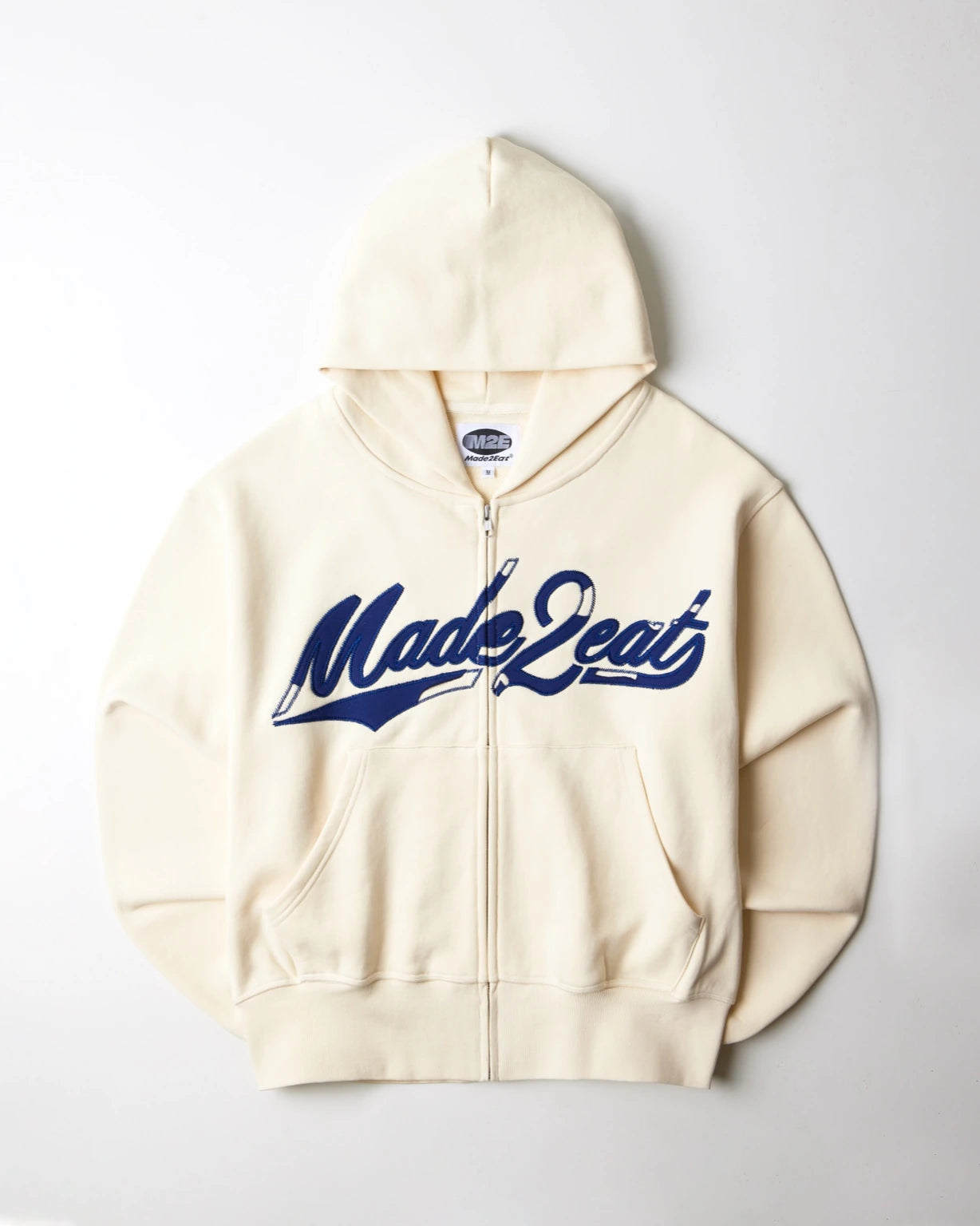Cream rope stitched hoodie with made2eat stitched across the chest. Made from 420 GSM French terry