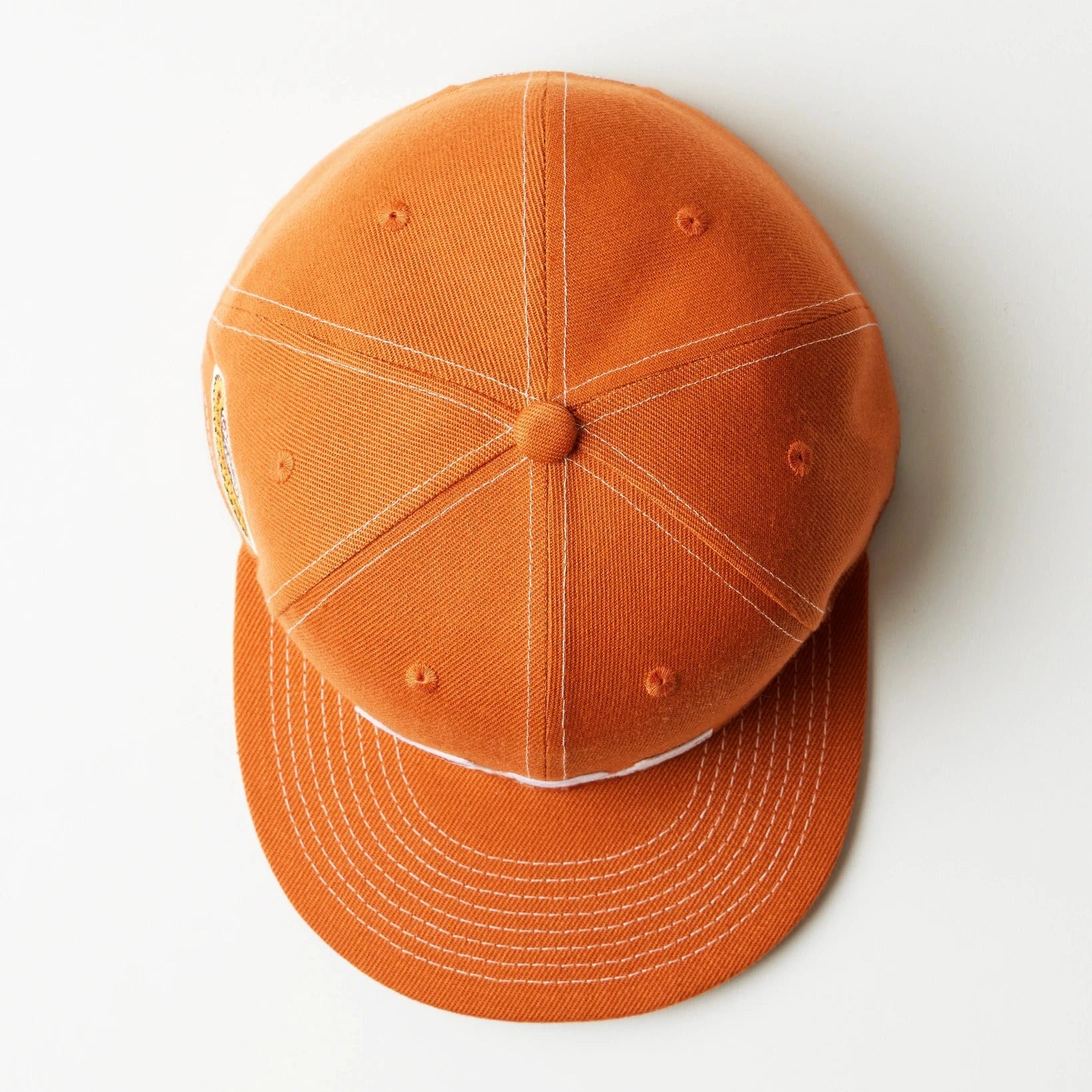 Orange fitted cap on a white background