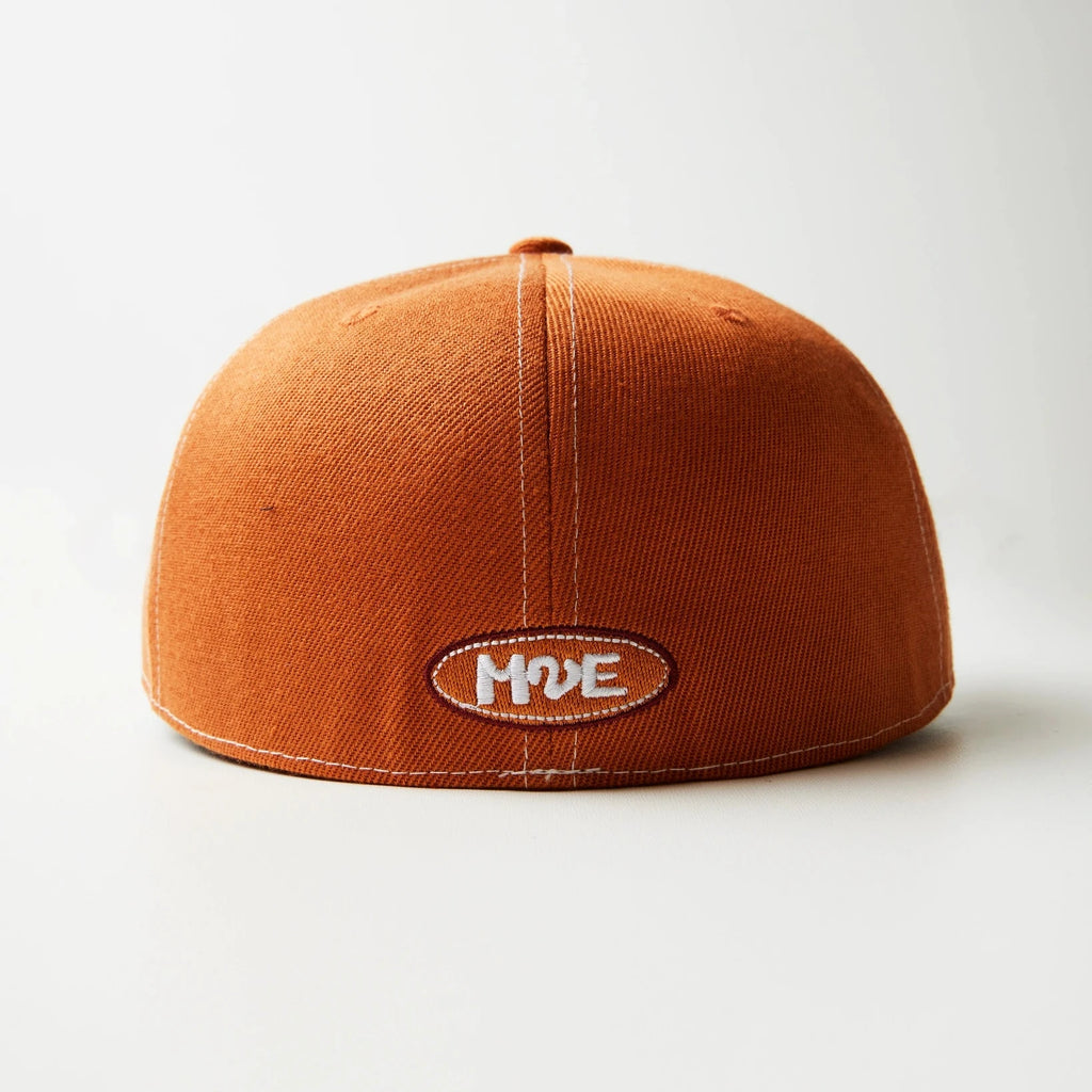 Orange fitted cap with a logo on a white background