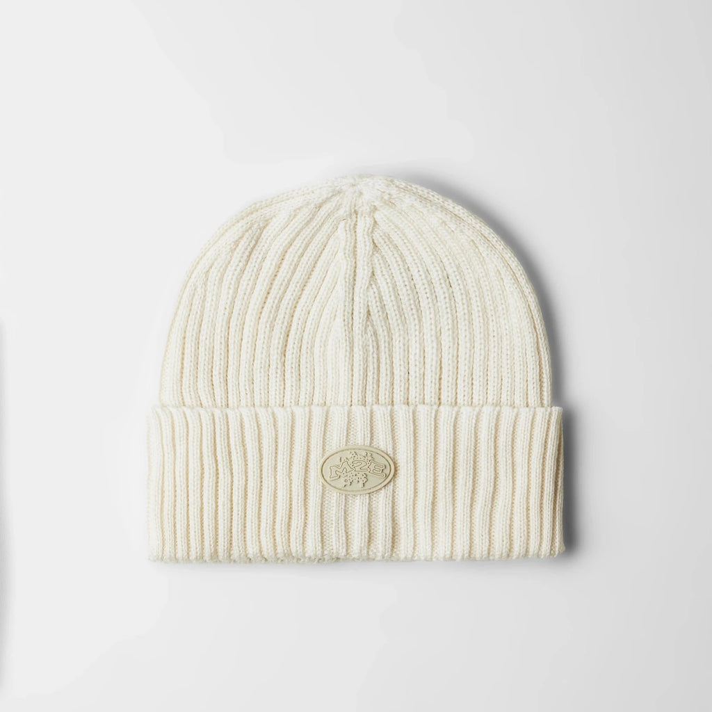 a cream skully beanie product photo on a white background