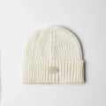 a cream skully beanie product photo on a white background