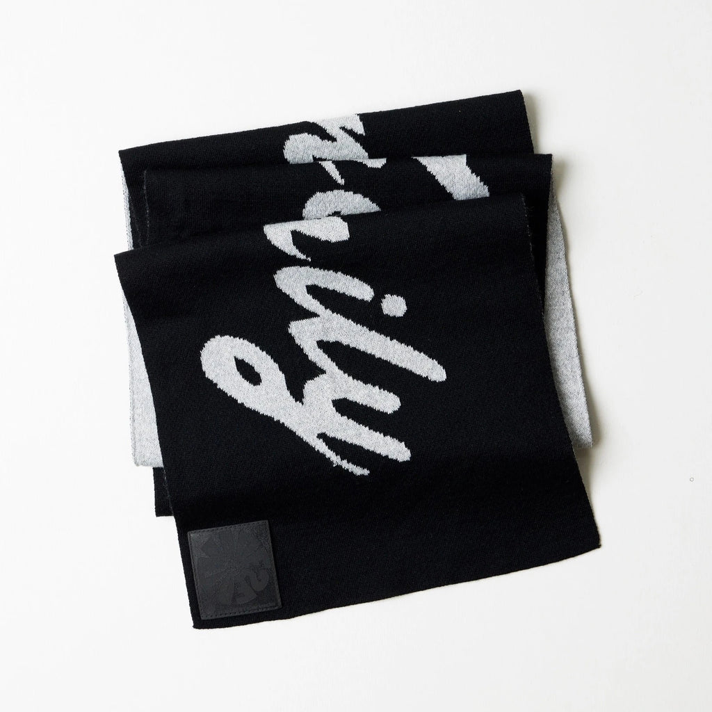 Black scarves with white text on a white background