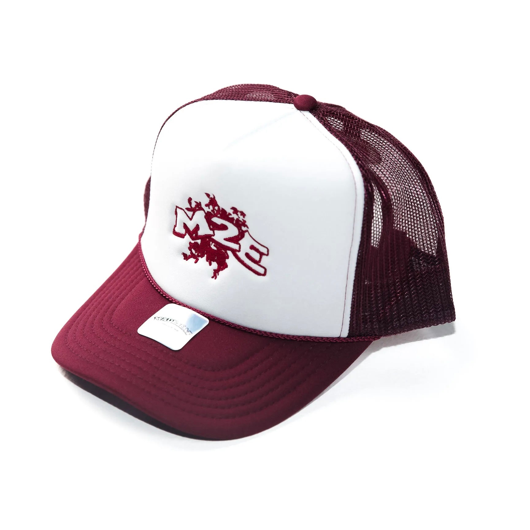 Maroon and white M2E trucker cap with a logo on a white background